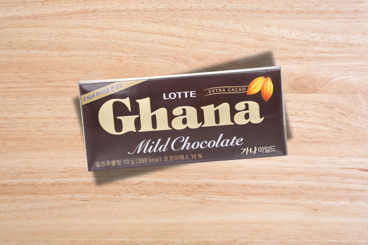 Lotte Ghana Mild Chocolate bar on a wooden surface