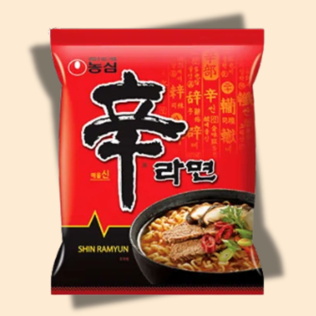 Contents of the $25 K-Snack Starter Korean ramen subscription box with ramen, candy, and biscuits